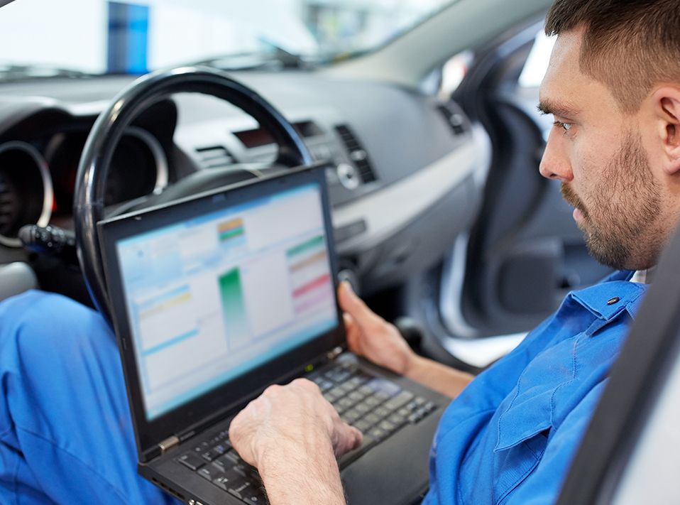 Mechanic diagnosing a vehicle using a computer - Car Diagnostics West Bromwich